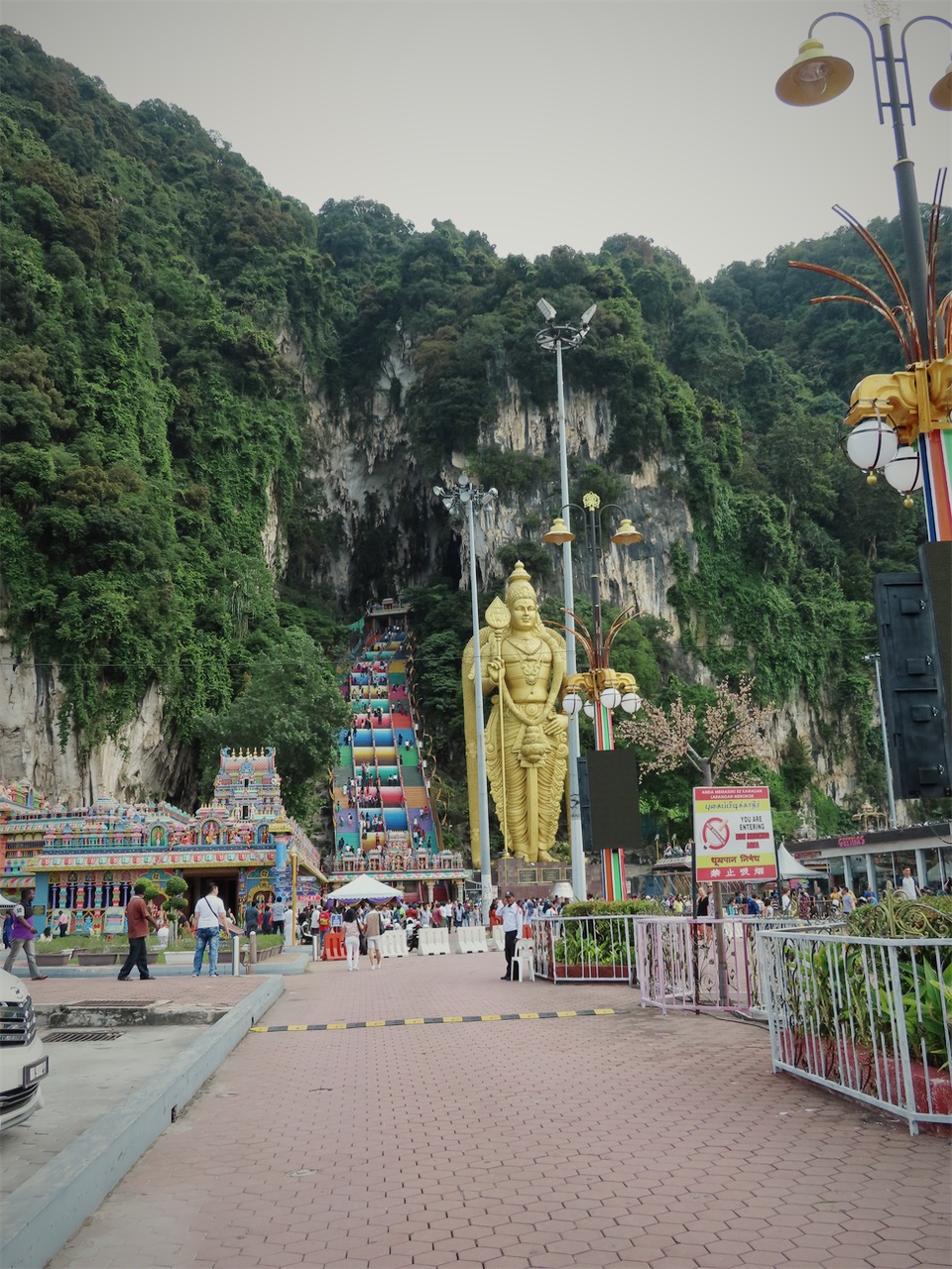 The golden statue and rainbow staircase at Batu Caves